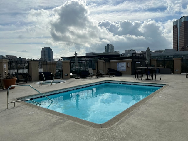 view of swimming pool with a patio