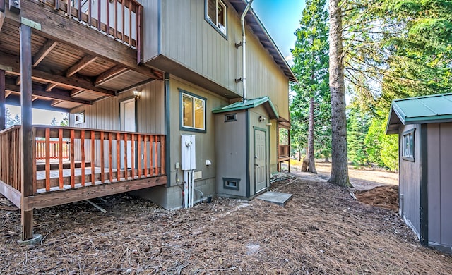 view of home's exterior featuring a wooden deck