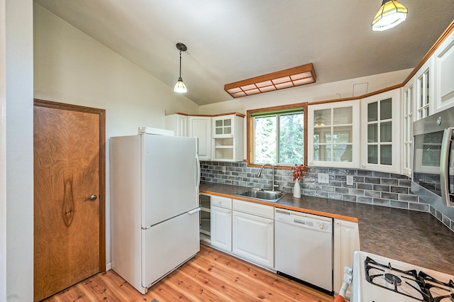 kitchen featuring white appliances, light hardwood / wood-style floors, white cabinetry, and sink