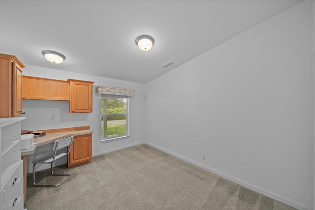 office featuring light carpet and built in desk