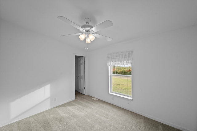 carpeted empty room with ceiling fan