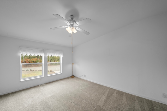 unfurnished room with carpet and ceiling fan