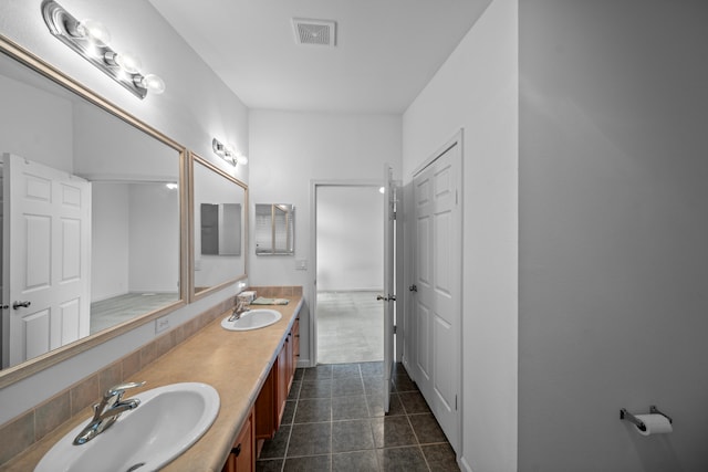 bathroom with vanity and tile patterned floors