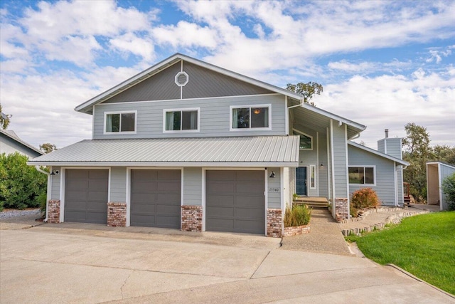 15540 China Rapids Dr, Red Bluff, CA 96080 - view of front facade featuring a garage, concrete driveway, and brick siding