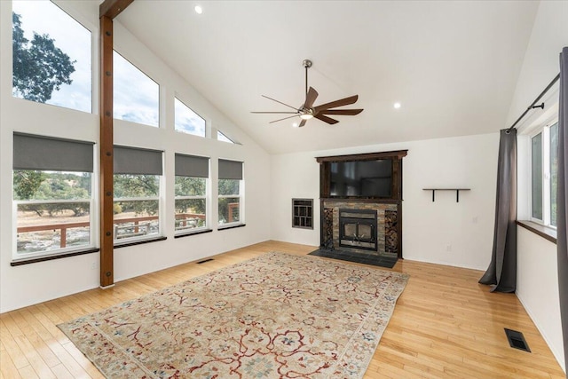 15540 China Rapids Dr, Red Bluff, CA 96080 - living area featuring ceiling fan, light wood-style floors, high vaulted ceiling, a fireplace with flush hearth, and recessed lighting