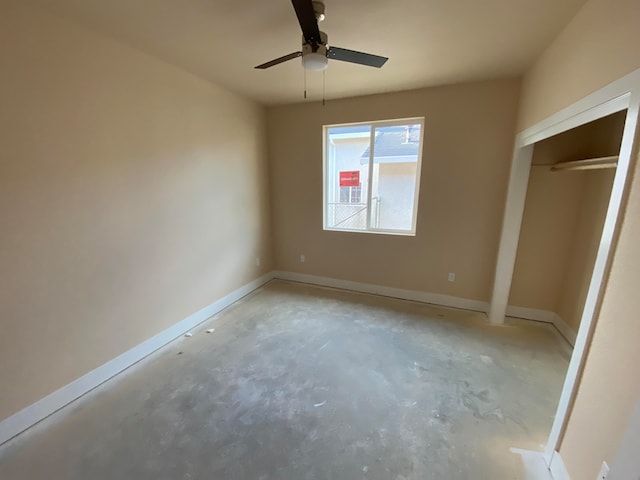 unfurnished bedroom with a closet and ceiling fan