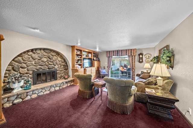 living room featuring carpet, a textured ceiling, a fireplace, and built in shelves