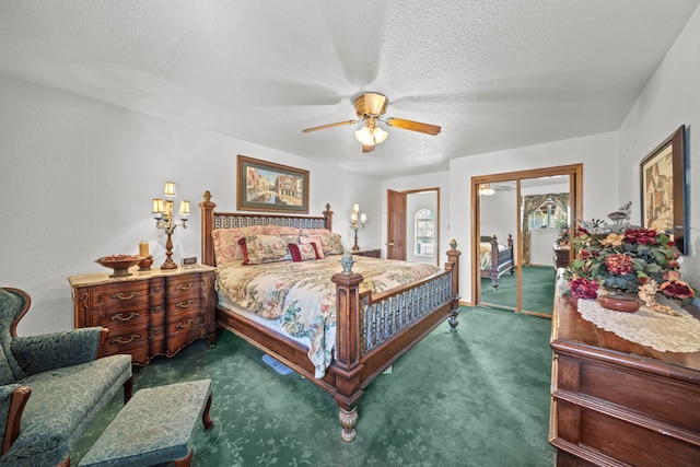 carpeted bedroom with a textured ceiling and ceiling fan