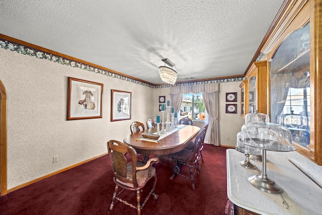 dining area featuring crown molding, a textured ceiling, and dark carpet