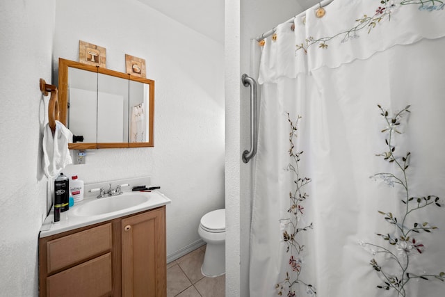 bathroom featuring toilet, curtained shower, vanity, and tile patterned flooring