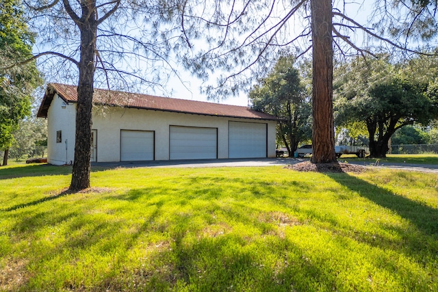 garage with a lawn