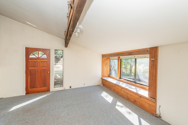 carpeted foyer entrance featuring lofted ceiling with beams