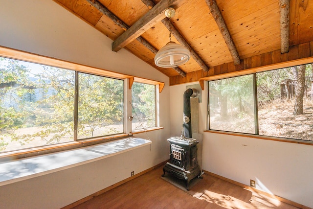 unfurnished sunroom featuring a wood stove, lofted ceiling with beams, and wood ceiling