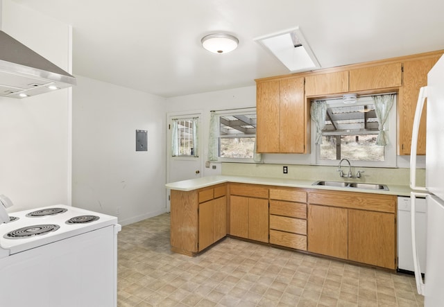 970 Branstetter Ln, Redding, CA 96001 - kitchen with white appliances, wall chimney exhaust hood, a sink, light countertops, and a peninsula