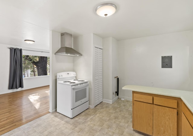 kitchen featuring electric panel, light hardwood / wood-style floors, white range with electric stovetop, and wall chimney range hood