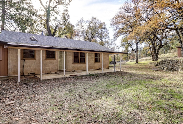 rear view of property featuring a patio area