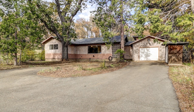 single story home with a garage