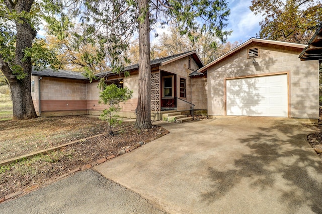 ranch-style house featuring a garage