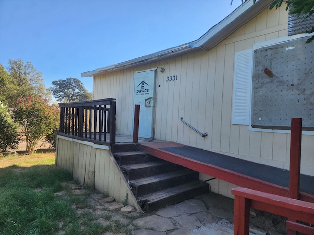 property entrance with a deck