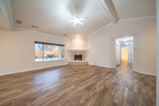 unfurnished living room with vaulted ceiling with beams, ceiling fan, crown molding, and dark wood-type flooring