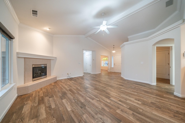 unfurnished living room featuring crown molding, ceiling fan, wood-type flooring, and lofted ceiling