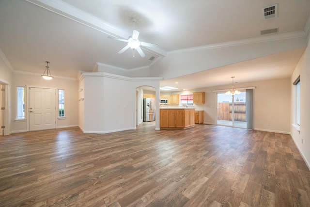 unfurnished living room featuring vaulted ceiling with beams, crown molding, dark wood-type flooring, and ceiling fan with notable chandelier