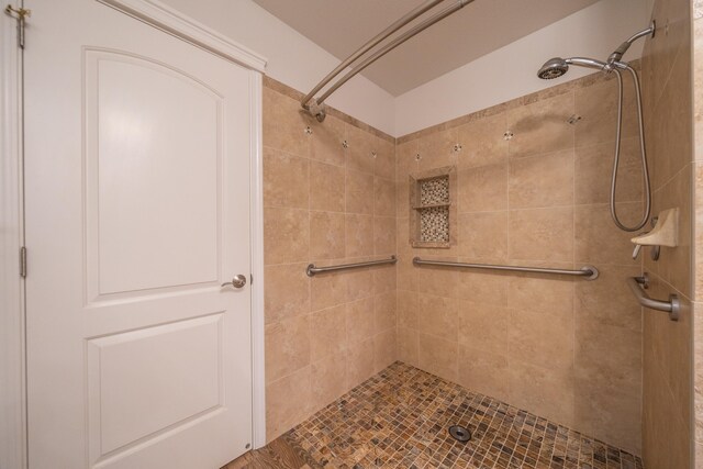 bathroom with tiled shower