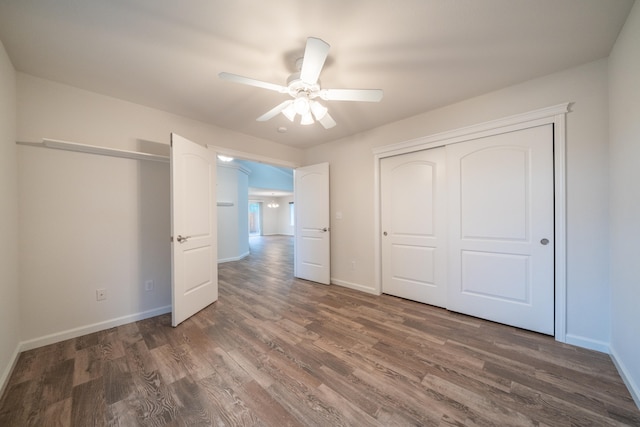 unfurnished bedroom featuring dark hardwood / wood-style flooring, a closet, and ceiling fan