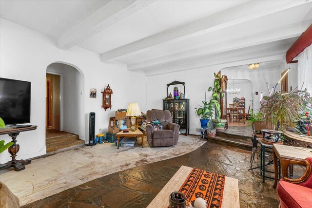 385 Manzanita Ln, Redding, CA 96002 - living area with arched walkways, beam ceiling, and a chandelier