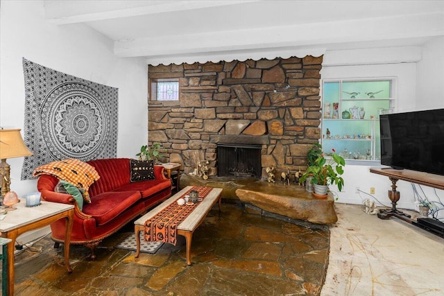 385 Manzanita Ln, Redding, CA 96002 - living room featuring beam ceiling, stone finish floors, and a fireplace