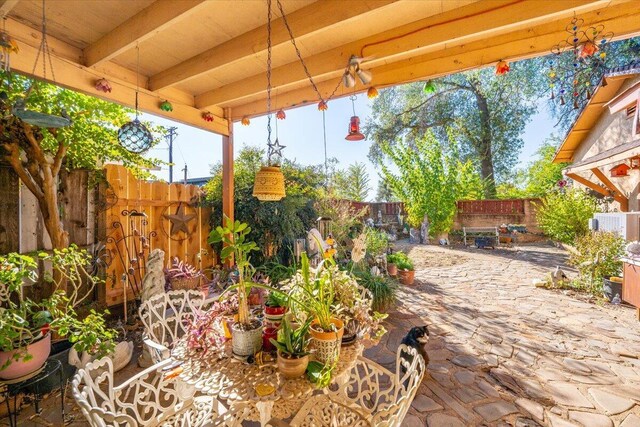 385 Manzanita Ln, Redding, CA 96002 - fenced backyard featuring a patio