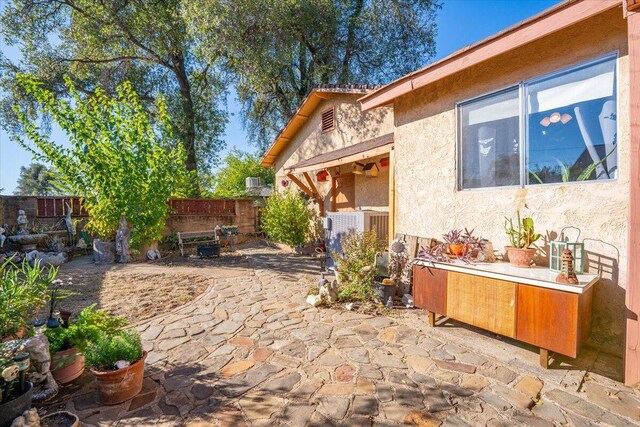 385 Manzanita Ln, Redding, CA 96002 - fenced backyard with a patio area and central air condition unit