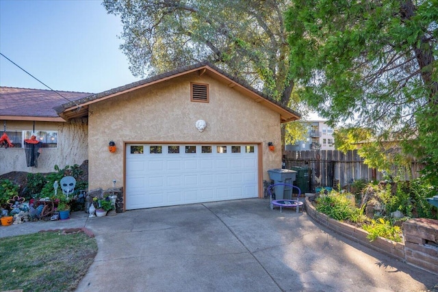 385 Manzanita Ln, Redding, CA 96002 - view of side of property with stucco siding, driveway, and a garage