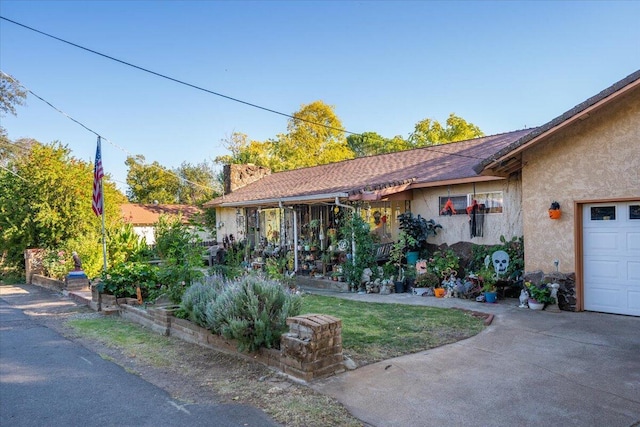 385 Manzanita Ln, Redding, CA 96002 - view of front of house with stucco siding and concrete driveway