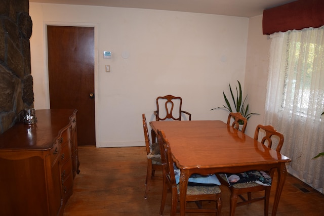 dining area with dark hardwood / wood-style floors