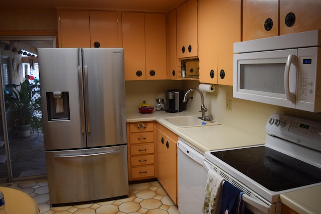 kitchen with sink and white appliances