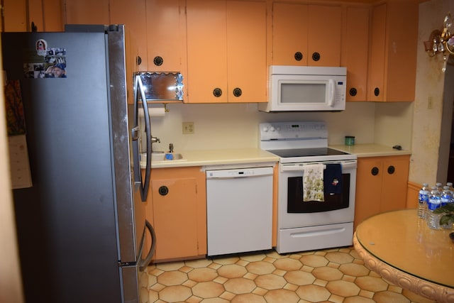 kitchen with white appliances and sink