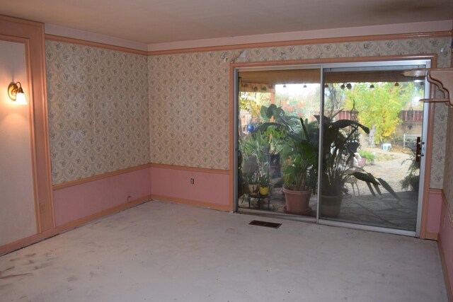 385 Manzanita Ln, Redding, CA 96002 - empty room with wallpapered walls and concrete flooring