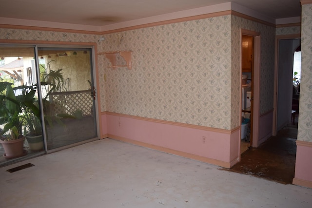 385 Manzanita Ln, Redding, CA 96002 - empty room featuring wallpapered walls, healthy amount of natural light, concrete flooring, and baseboards