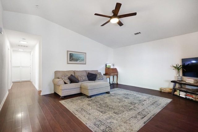 living room featuring ceiling fan, dark hardwood / wood-style floors, and vaulted ceiling