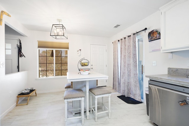 dining area with a chandelier