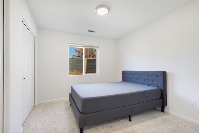 carpeted bedroom with a closet