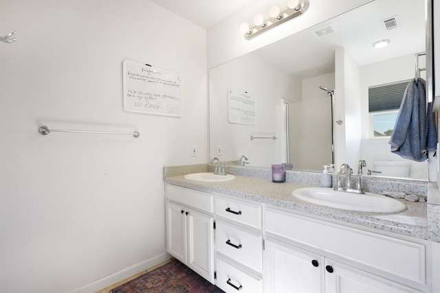 bathroom with vanity and walk in shower