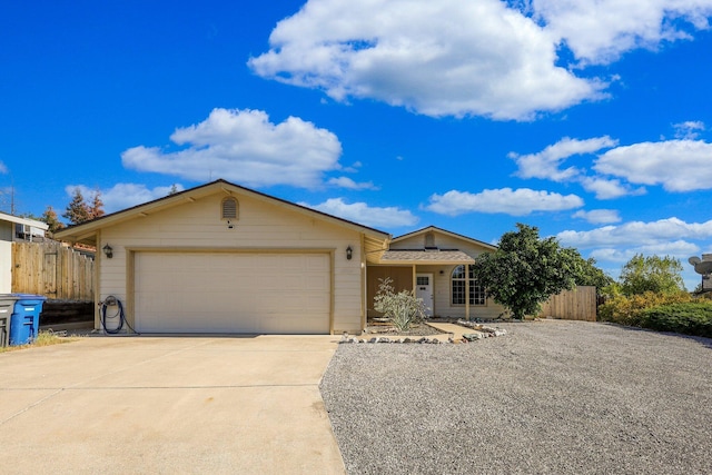 ranch-style house featuring a garage