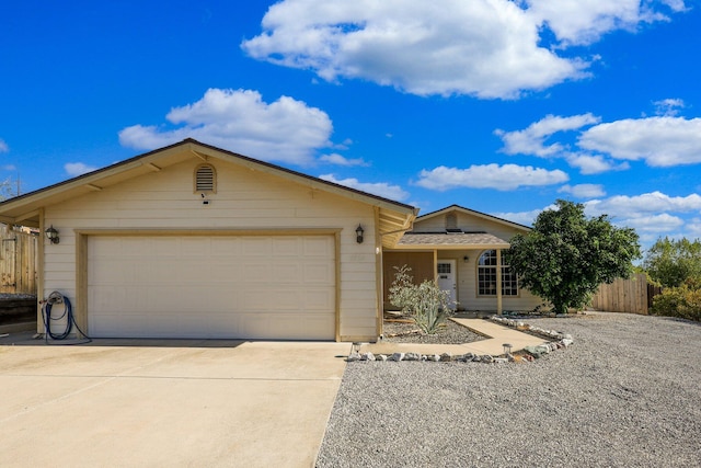 ranch-style house featuring a garage