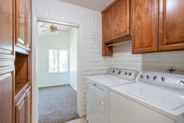 laundry room with cabinets, independent washer and dryer, light colored carpet, and ceiling fan