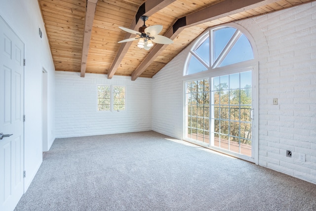 carpeted spare room with wood ceiling, lofted ceiling with beams, ceiling fan, and brick wall