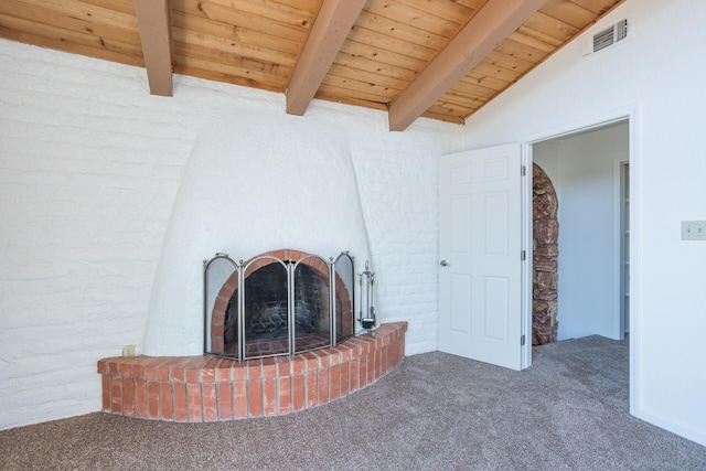 unfurnished living room featuring lofted ceiling with beams, carpet floors, a fireplace, and wooden ceiling