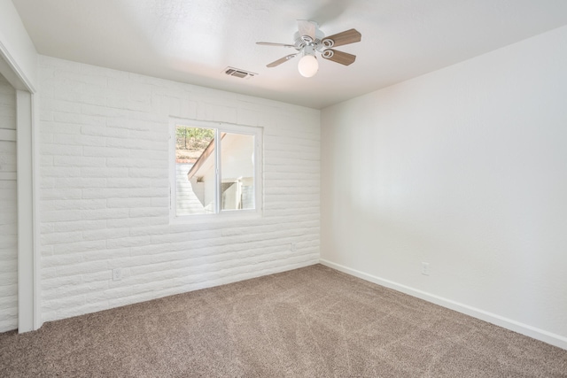 empty room featuring carpet and ceiling fan