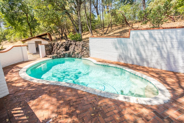 view of swimming pool with a patio area